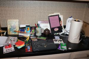 lot 493 image: Misc. lot writing paper roll, Rapunzels paper doll outfits, officeschool supplies and more