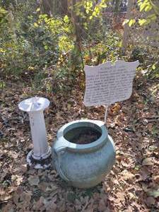 lot 689 image: Sun dial, cast iron sign and heavy planter