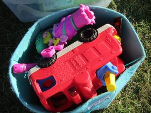lot 26 image: blue box full of kids toys all used