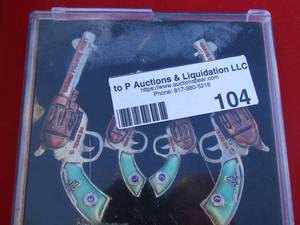 lot 104 image: framed gun art ( not real )