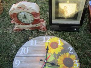lot 33 image: sunflower clock- alarm clock- stone clock