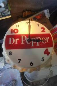 lot 2 image: Vintage Dr Pepper Bottle Cap Wall Clock Electric Lighted It measures approx. 11 in diameter and stands off the wall 4.Works