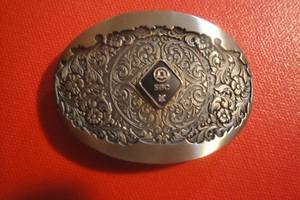 lot 16 image: Southwestern Bell Service Belt Buckle with Diamond Chip, Solid Brass, 2 12x 1 34, O.C. Tanner