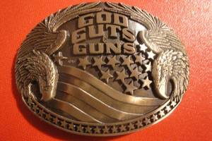 lot 34 image: God, Guts & Guns Solid Brass Belt Buckle by Award Design Medals, 3 34 x 2 34