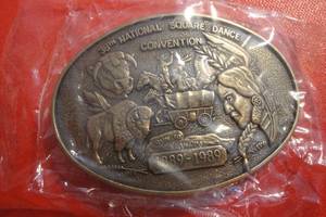 lot 64 image: 38th National Square Dance Convention Belt Buckle, 3 12x 2 12, Run to Oklahoma 1889-1889, Sealed in Plastic