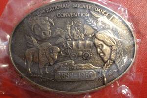 lot 73 image: 38th National Square Dance Convention Belt Buckle, 3 12x 2 12, Run to Oklahoma 1889-1889, Sealed in Plastic