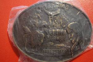 lot 79 image: Oklahoma Run to Oklahoma 1889-1989 Belt Buckle, Sealed in Plastic, 3 12x2 12