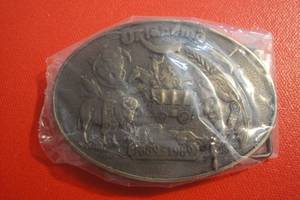 lot 85 image: Oklahoma Run to Oklahoma 1889-1989 Belt Buckle, Sealed in Plastic, 3 12x2 12