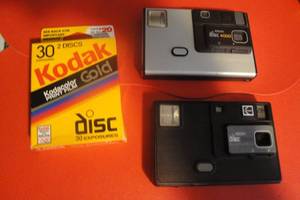 lot 35 image: 2 Vintage Kodak Disc Cameras, 1- Kodak Disc 3000, 1-Kodak Disc 4000 with 1-30 Exposure Disc Film