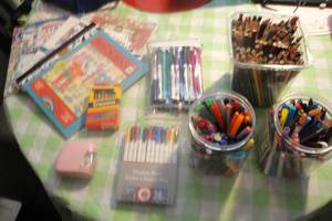 lot 146 image: Lot of 7 Adult Color Books, Large Tub of Colored Pencils, 2 Tubs of Markers, 2 Packs of Markers, Box of Crayons, Battery Operated Pencil Sharpener