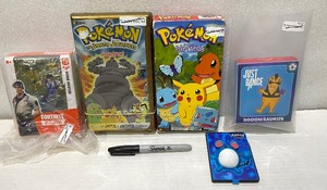 lot 148 image: Lot Of 5 - (2) Pokemon VHS Movies, (1) Pokemon Toy, (1) Fortnite Toy & (1) Just Dance Boogiesaurus - In Condition As Shown
