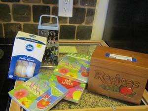 lot 63 image: plastic spoons - napkins- cheese shredder - recipe box