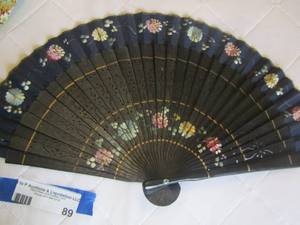 lot 89 image: Floral blue small hand fan