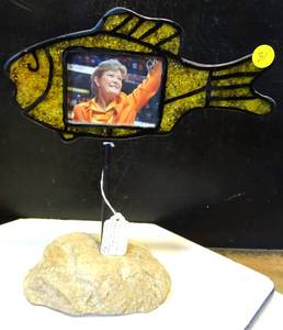 lot 31 image: STONE BASED METAL PHOTO DISPLAY IN SHAPE OF FISH