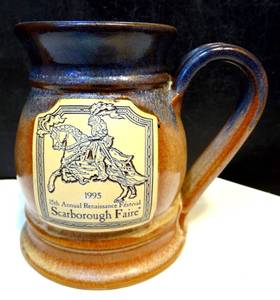 lot 212 image: COLLECTIBLE 1995 SCARBOROUGH FAIR RENAISSANCE VILLAGE MUG WITH FAMOUS SWIRL BOTTOM (CHECK COMPS) $$