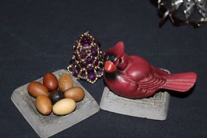 lot 50 image: Toga Woodworks Mahogany eggs, Fine Art Gallery Cardinal and hand made Beaded Christmas ornament