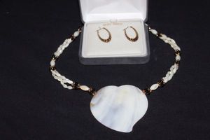 lot 3 image: 10K Gold Hoop Earrings and Mother of Pearl necklace