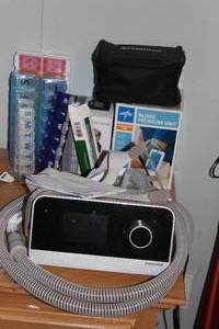 lot 242 image: Sleep Apnea Machine and Extra Supplies, BP Machines and Weekly Medication Organizers