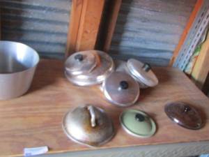 lot 34 image: various pot lids with various pans