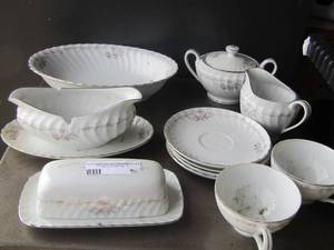 lot 89 image: Genuine Porcelain China dish set, sugar, creamer set, 3 cup plates, 2 handled cups, salad bowl, gravy boat, butter dish
