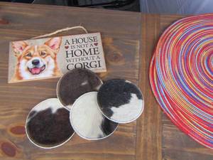 lot 30 image: Corgi hanging wall sign, Cow Hide coasters, place mats