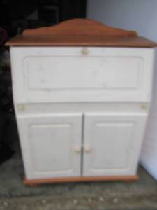 lot 22 image: white kitchen cabinet with storage and a fold down top