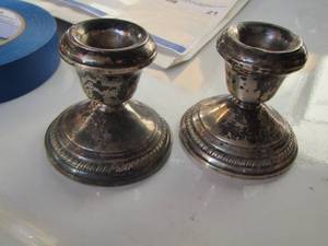 lot 17 image: 2 Sterling weighted candle stick holders , weight unknown