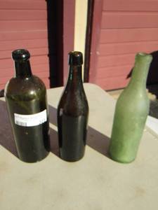 lot 305 image: Green glass bottles
