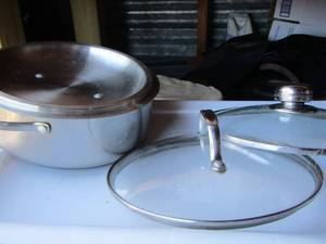 lot 394 image: pot with lid and other lids