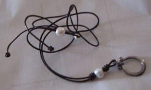 lot 420 image: BLACK CORDED NECKLACE WITH 2 BEADS AND SILVER