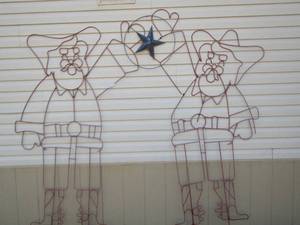 lot 29 image: Cowboy Santa metal yard art approx 5ft tall