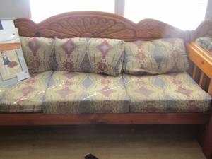 lot 269 image: Brown wooden couch with cushions