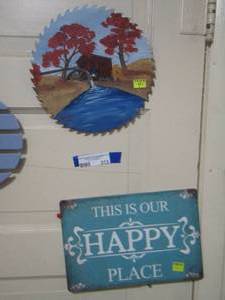 lot 313 image: This is our happy place metal sign, painted saw blade,
