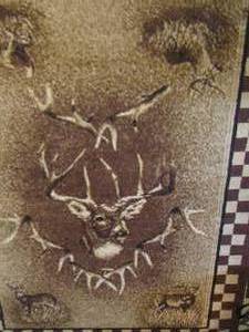 lot 30 image: 5ft x 7 ft. deer and buck area rug