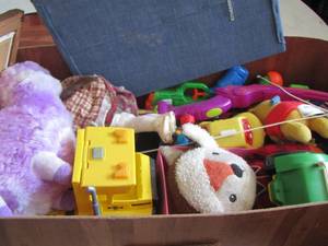lot 410 image: Brown toy box full of preowned kids toys