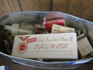 lot 514 image: metal bucket full of various matchbooks