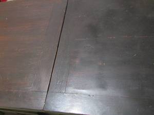 lot 537 image: 214424 solid wooden coffee table, top is split in middle and slides open for underneath storage, very cool piece
