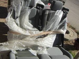 lot 553 image: single seat and double all brand new for a 2016 ford van, they was taken out of the van new on lot and been wrapped in plastic every since