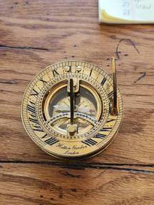 lot 42 image: Vintage Hatton Garden London solid brass sundial and compass with leather case