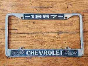 lot 9 image: 1957 Chevrolet license plate cover