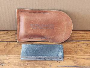 lot 100 image: Sharpening stone with leather case - Soft Novaculite