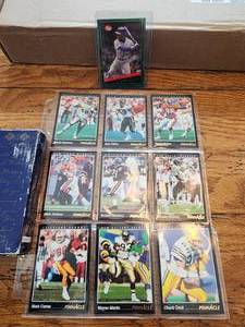 lot 109 image: Selection of Pinnacle football cards and Post Ken Griffey Jr. baseball card