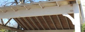 lot 7 image: Cedar Structure with Galvanized Metal Sheets Buyer is responsible for disassembly and removal of structure Approx 20ft long boards are 2x6