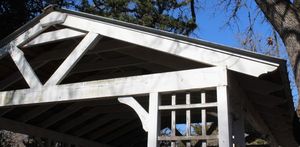 lot 15 image: Cedar Structure with Galvanized Metal Sheet Roof Buyer is responsible for disassembly and removal of structure Approx 20ft long 1x4 Cedar boards