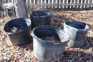 lot 24 image: Four 30 Gallon Pots Approximately 12 full of Limestone Landscaping Rocks