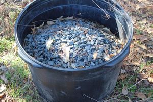lot 25 image: 30 Gallon pot of Landscaping rocks