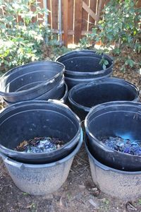 lot 8 image: 30 Gallon Pots Approximately half full of Blue Glass Rock See Photos