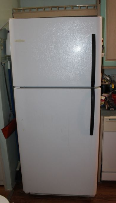 lot 4 image: Frigidaire Freezer over Fridge. Model # FRT21KD3AS5 Manufactured 12003 Currently in Use