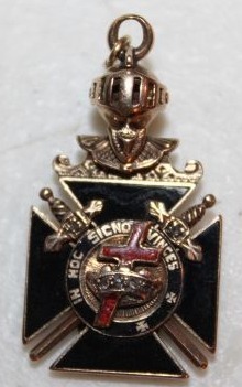 lot 1 image: Vintage Knights of the Templar Watch fob. Movable Knight Bust atop the Cross. Either Side of the Cross Features Masonic Symbols a Red Enameled Cross and Crown with Tiny Diamonds with the Keystone Accented in White Enamel. Jewelry store stated it is 14k