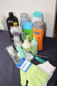 lot 35 image: Hair Care and Bath Items Tresemme Shampoo, V05 Shampoo, Sauve Kids Shampoo, Bath Salts, Dove Shampoo, Suave Shampoo, nail care items, body scrub gloves, Tweezers